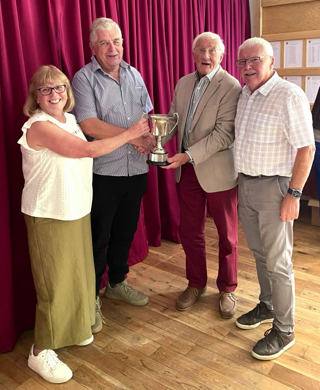 Triples Competition winners receiving their Cup